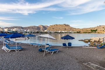 Fototapeta na wymiar Haraki beach with quiet with crystal clear waters and boats, Rhodes, Greece 