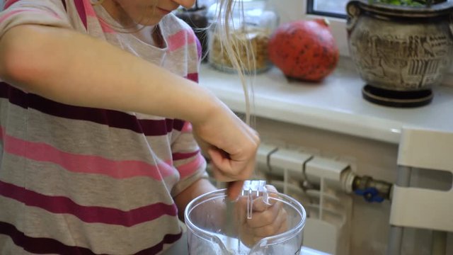 child girl cooking a cakes at the private kitchen