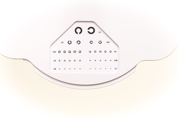 the cabinet of the eye doctor. eye sight test called landolt C. with copy space