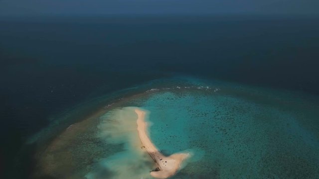 Aerial view of beautiful sand tropical island with white sand beach. White sand island. Beautiful sea ,resort. Seascape: ocean and beautiful beach paradise. Philippines, Camiguin. 4K video. Travel