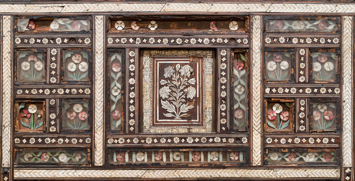 Closeup of wooden seamless floral pattern ornaments on old wooden chair