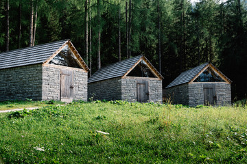 Three stone and wood cottages in the mountain