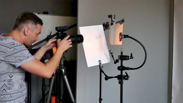 a young photographer in the process of working in a photography studio. unintended photography