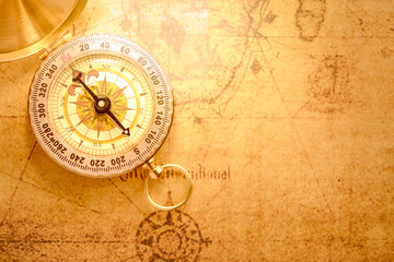 Old vintage compass on vintage map
