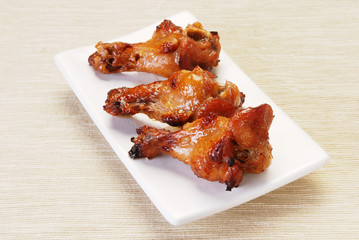 Grilled chicken leg on plate 