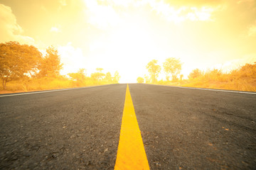 Naklejka premium Asphalt road in rural with golden color