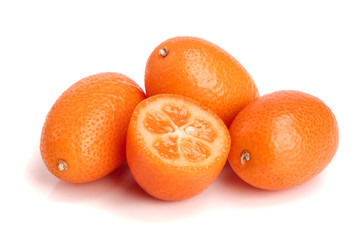 Cumquat or kumquat with half isolated on white background close up