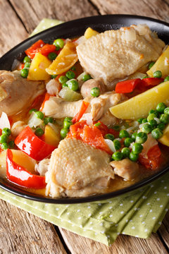 popular Filipino meal stew of chicken with vegetables - afritada closeup in a bowl. vertical