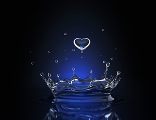 Water drop in form of heart in blue spot light