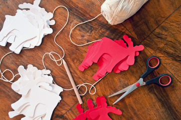 Christmas diy white red paper background.  Making craft xmas ornaments