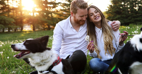 Romantic happy couple in love enjoying their time with pets