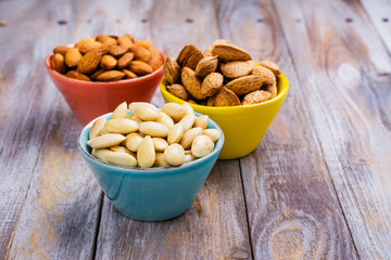 Assortment of almond nuts - peeled and fried, unpeeled and almonds in shells