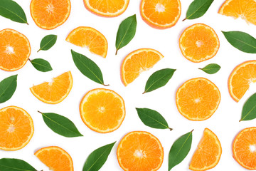 Slices of orange or tangerine with leaves isolated on white background. Flat lay, top view. Fruit composition