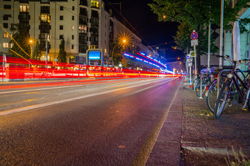 Abstract effect of long exposure light trails at night on busy Berlin street