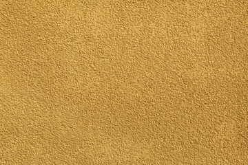 Fototapeta premium Yellow painted stucco wall. Background texture