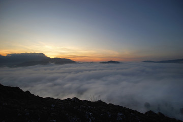 Fototapeta na wymiar sunrise over the hills with sea fog