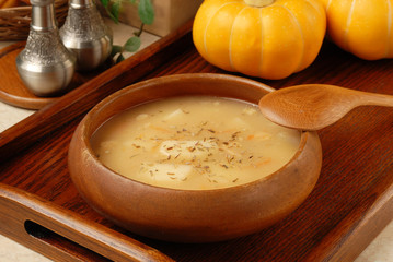 Potato soup in a wooden bowl 