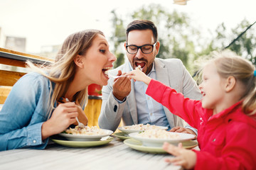 Family enjoying pasta