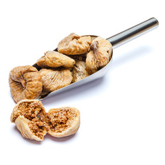 scoop full of dried figs isolated on white background. clipping path