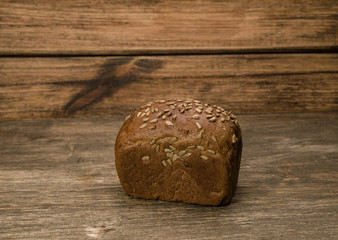 Obraz na płótnie Canvas Bread on a wooden background
