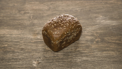 Naklejka premium Bread on a wooden background