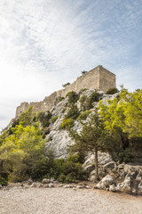 Fototapeta na wymiar The Castle of Monolithos in Rhodes, Greece, is perhaps the most impressive castle of Rhodes and it is located on a 236 m high rock, overlooking the sea