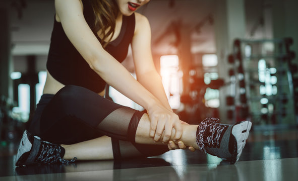 Woman Doing Sport Exercise Injury Leg Accident At Gym Fitness