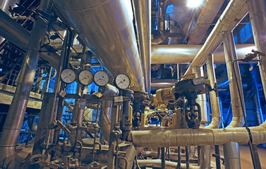 Equipment, cables and piping as found inside of a modern industrial power plant