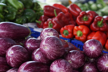 Selected eggplants on the counter in the vegetable market