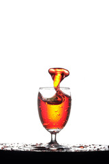 Pouring Splash the amber liqueur into a glass of booze, The concept of alcohol is like the poisonous snake.