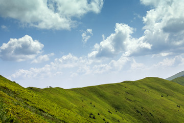 Obraz premium Hikers on the top of the ridge in the mountains
