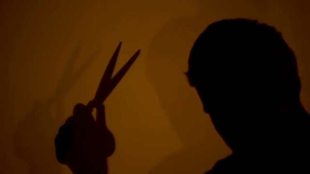 Fierce murderer mercilessly slashing victim with scissors unstoppable aggression