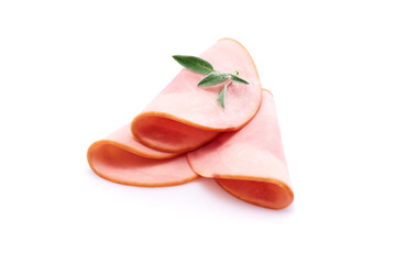 Cooked boiled ham sausage or rolled bologna slices isolated on white background with herbs and spices