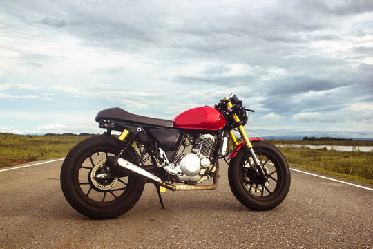 Vintage cafe racer motorcycle on the road. motorbike. Outdoors.
