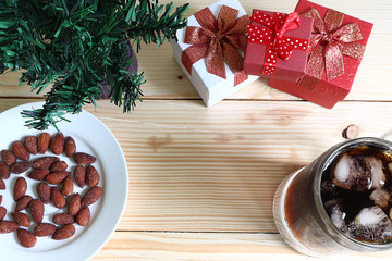 Top view glass of cola with snack and gift and christmas tree, have space for idea.