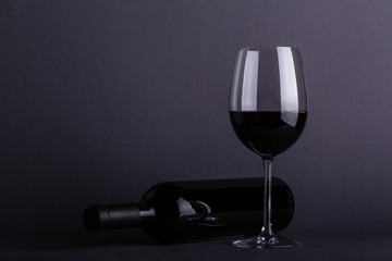 Red wine glass and bottle