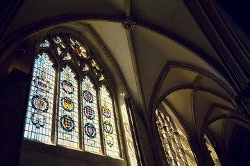 Coats of arms on colorful stained glass window in Chichester Cathedral - Cathedral Church of the Holy Trinity, West Sussex, England, United Kingdom of Great Britain and Northern Ireland