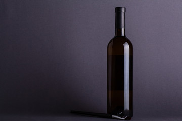 White wine bottle on grey