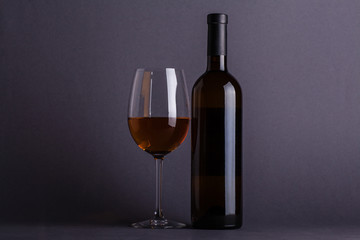 White wine glass and bottle