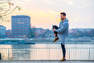 Young man stretching
