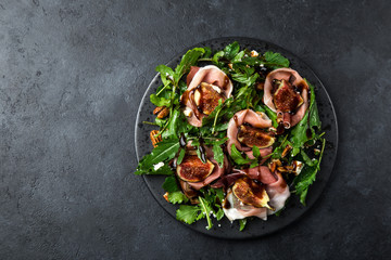 prosciutto, figs, arugula, goat cheese salad with pecan nuts and balsamic sauce