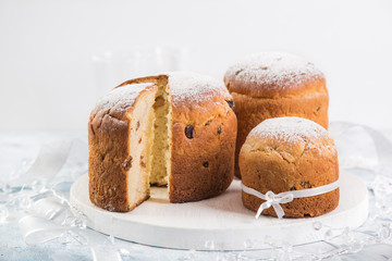 Panettone. Traditional italian Christmas cake with raisins and dried fruits, selective focus