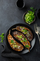 glazed grilled eggplants served with sesame seeds and green onion