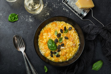 delicious pumpkin risotto, black background