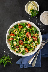 Avocado, tomato, chickpeas, spinach and cucumber salad