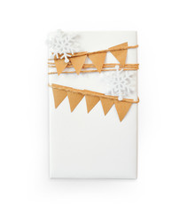 Christmas mockup Gift box wrapped in paper and snowflake top view isolated on white background, clipping path included