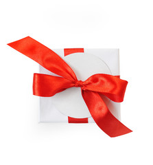 Christmas mockup Gift box wrapped in paper and with a red bow isolated on white background, clipping path included