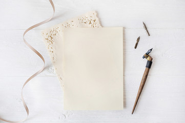 Mockup holiday letter Blank paper with pen on wood table, with space for your text, top view