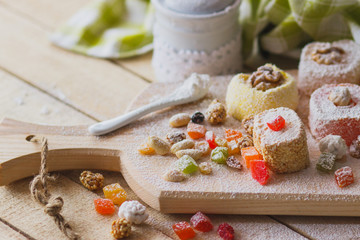 East sweets with fruits, nuts and sugar powder