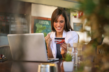 Woman checking count on credit card. Close up.